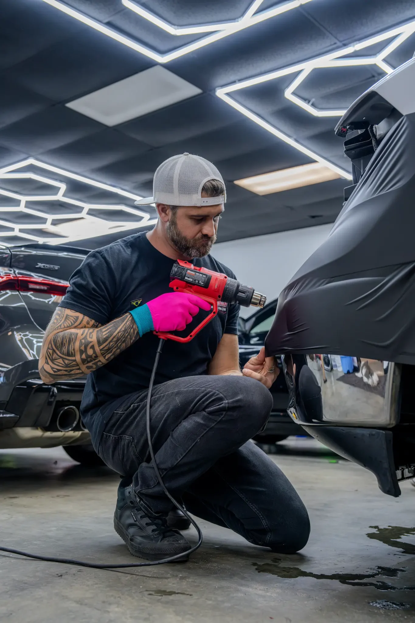 Fireball installer applying paint protection film
